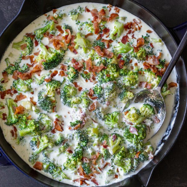 broccoli with bacon in alfredo in a pan