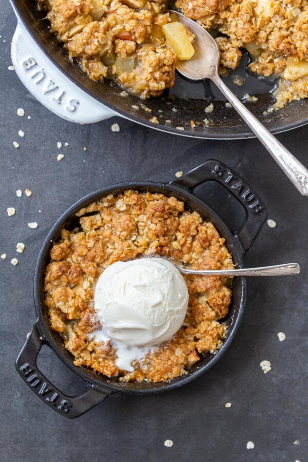 Apple crisp in a pan with ice cream