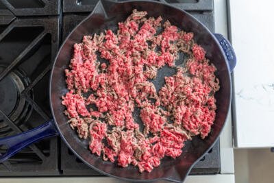 Ground beef frying on a pan