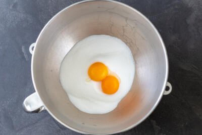 sugar and egg yolks in a mixing bowl