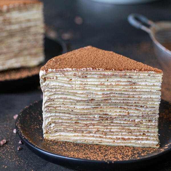 a slice of a Tiramisu Crepe cake