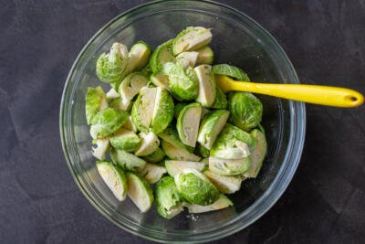 Brussels Sprouts in a bowl with seasoning