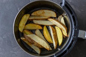 Air fryer potato wedges in a basket