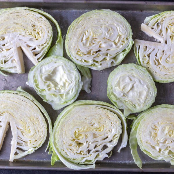 cut cabbage into pieces on a pan