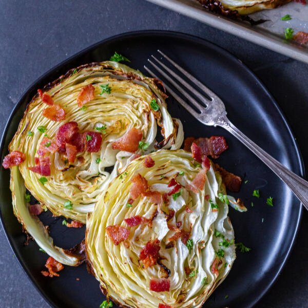 plate with crispy roasted cabbage steaks