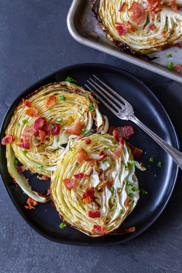 plate with crispy roasted cabbage steaks