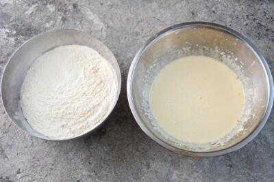 flour in a bowl and a separate bowl with wet ingredients