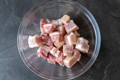 cut pork belly in a bowl