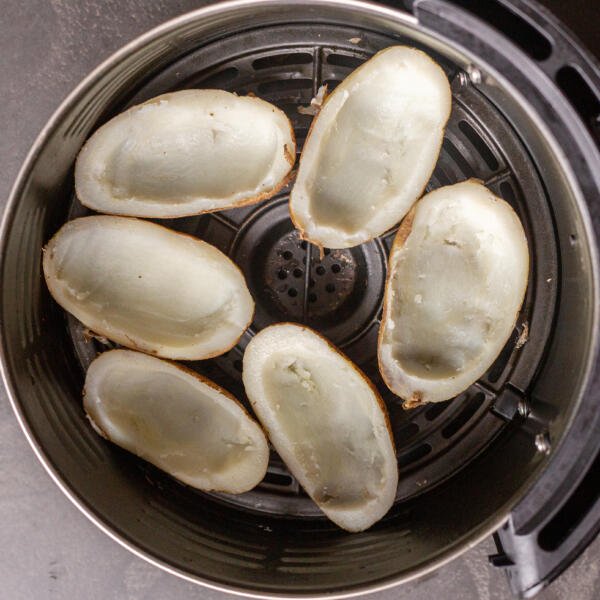 Potato skins in an air fryer basket