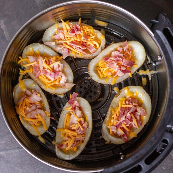 Loaded Potato skins in an air fryer basket