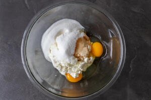 eggs, sugar and farmers cheese in a bowl