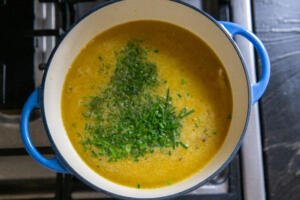 Pot with broth and herbs in a pot