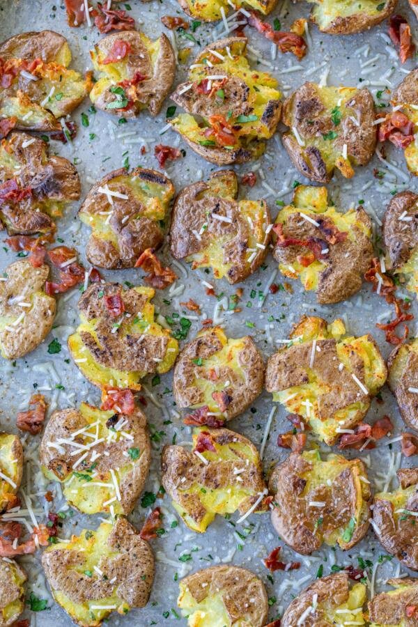 Smashed potatoes with herbs and bacon