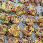 Smashed potatoes with herbs and bacon