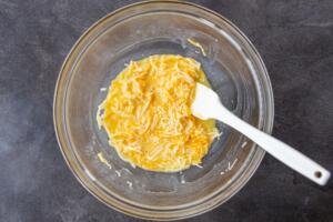 eggs combined with cheese in a bowl