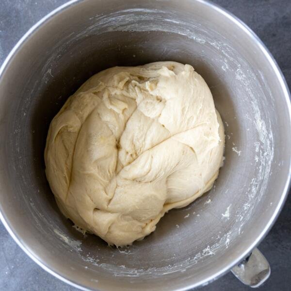 Kneaded dough is in Challah Bread dough in a bowl