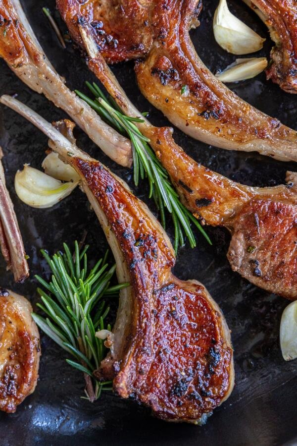 Lamb chops with garlic and herbs in a pan