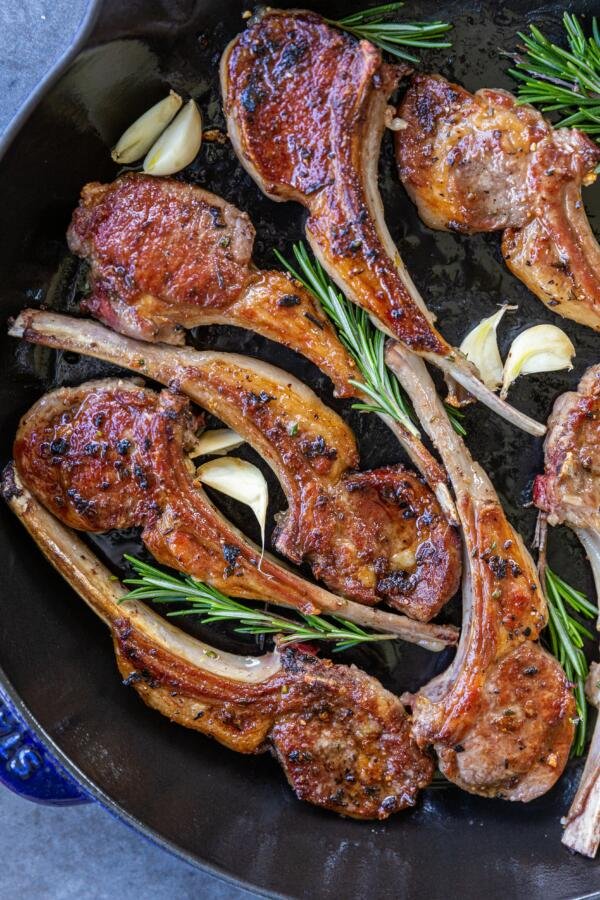 Lamb chops with garlic and herbs in a pan