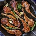 Lamb chops with garlic and herbs in a pan