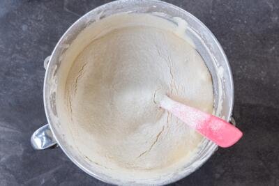 flour added to cake batter in a mixing bowl
