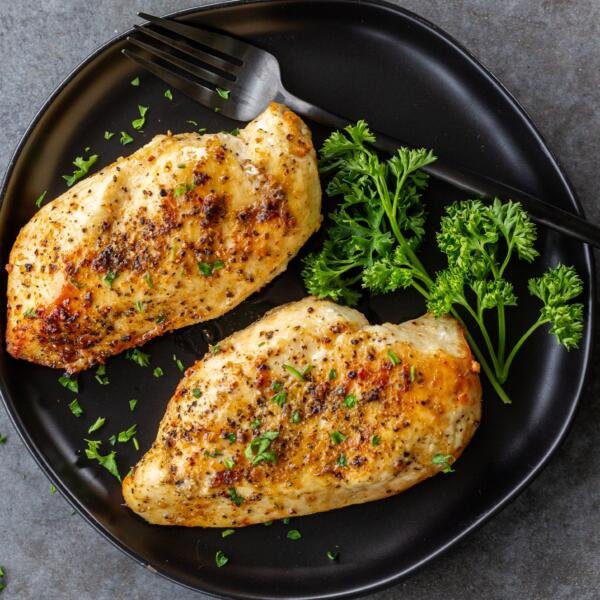 Chicken breast on a plate with herbs