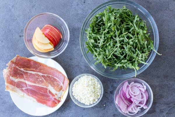 Ingredients for arugula salad on a counter