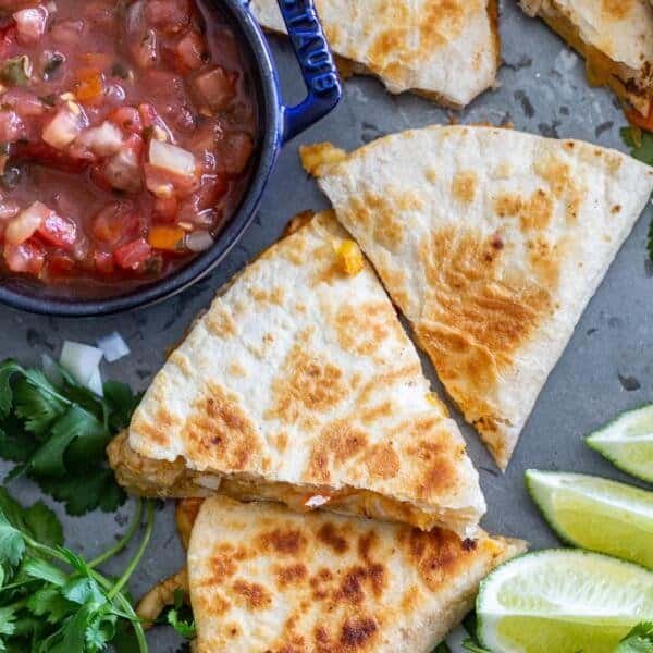 Cooked Quesadilla with salsa and lime