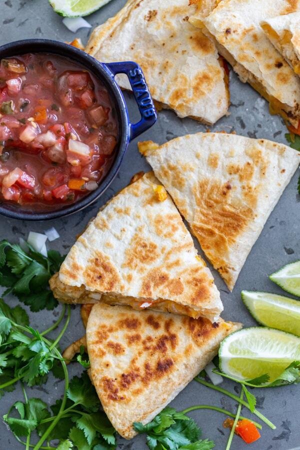 Cooked Quesadilla with salsa and lime