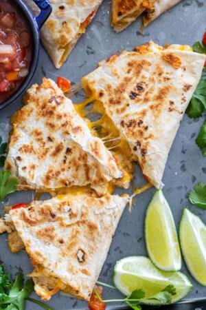 Cooked Quesadilla with salsa and lime