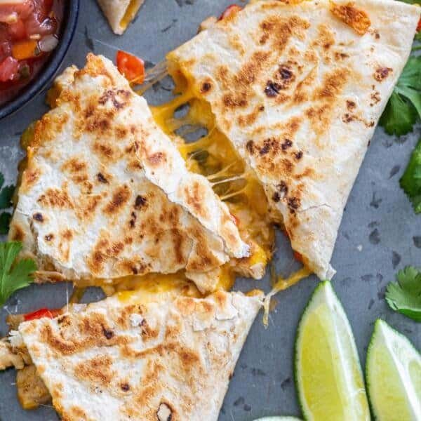 Cooked Quesadilla with salsa and lime