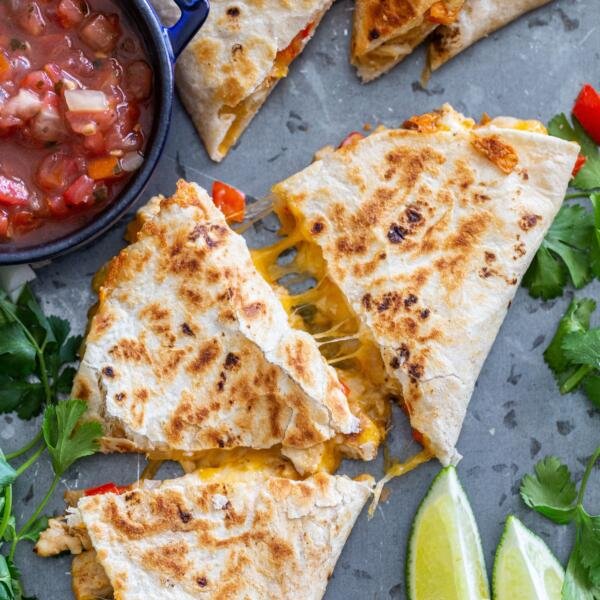 Cooked Quesadilla with salsa and lime