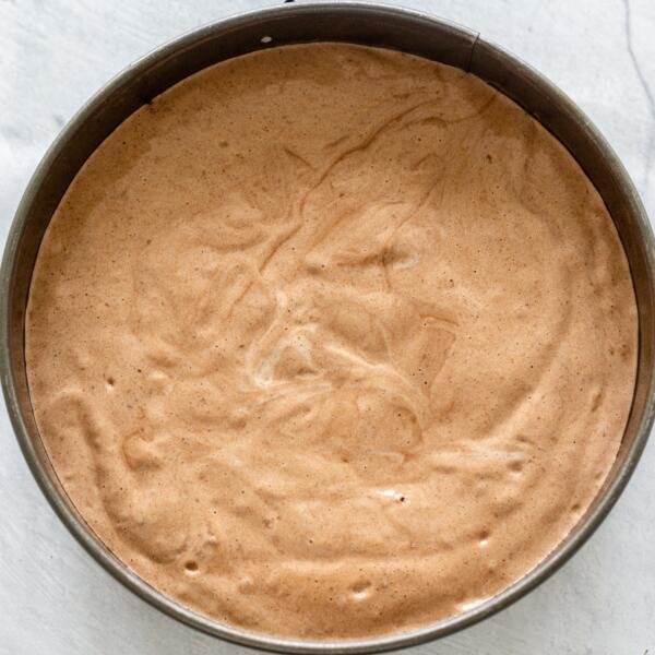 Chocolate sponge cake dough in a pan