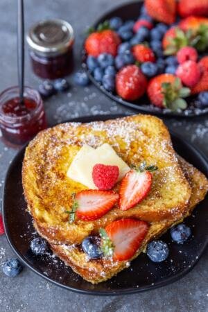 French toast on a plate with fruits