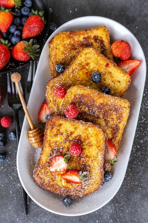 French toast in a plate with fruits