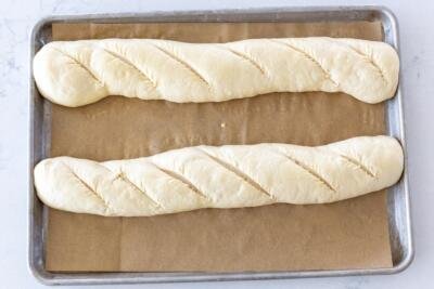 French bread on a baking sheet