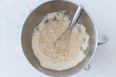 flour mixed into liquids in a mixing bowl