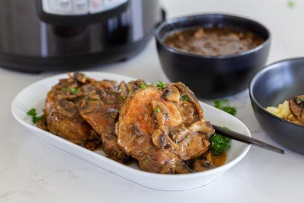 Pork chops on a plate with gravy