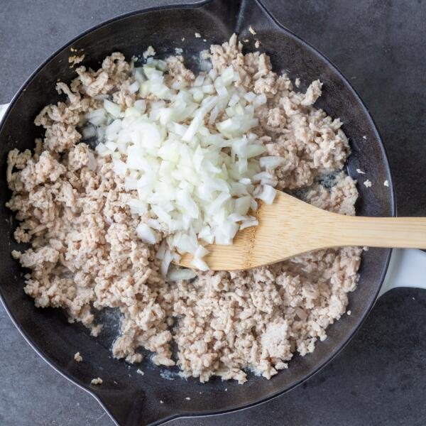 ground chicken with onion in a pan