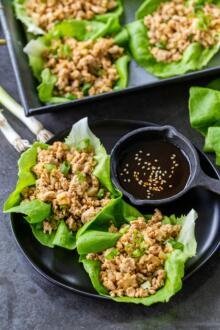 Chicken Lettuce wraps on a plate with sauce