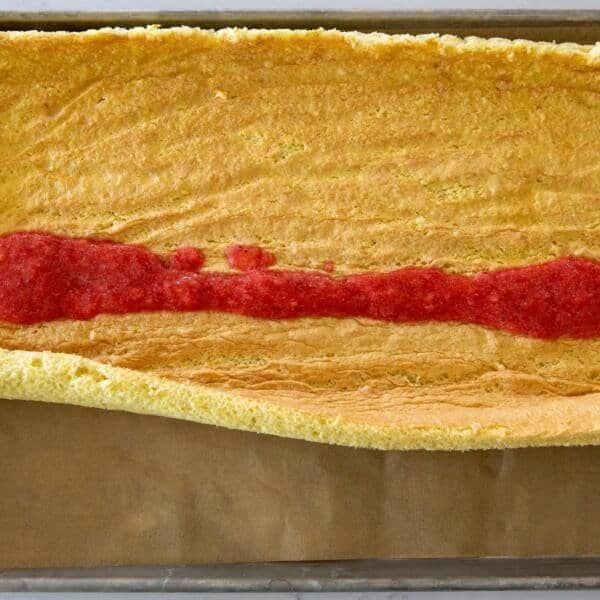 blended strawberries on a sponge cake