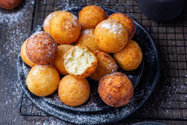 cooked donut holes on a plate