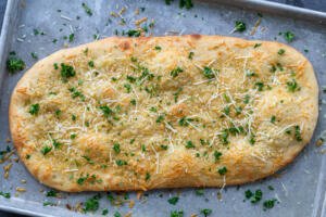 Baked flatbread with herbs and cheese