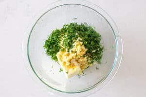 herbs, butter and garlic in a bowl