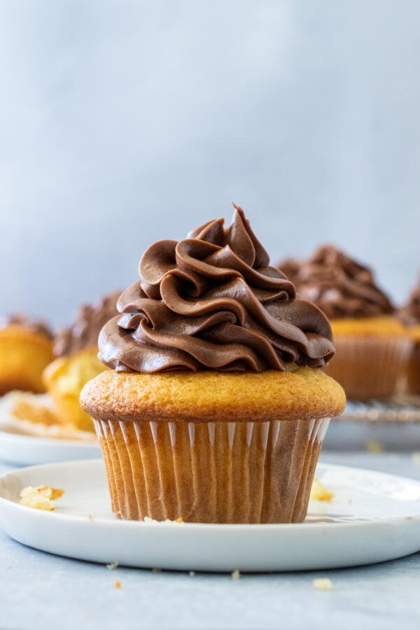 creamed cupcakes on a plate 