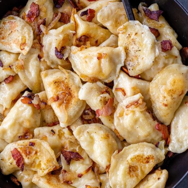 PIerogi with onion in a pan