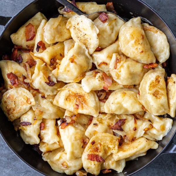 PIerogi with onion in a pan