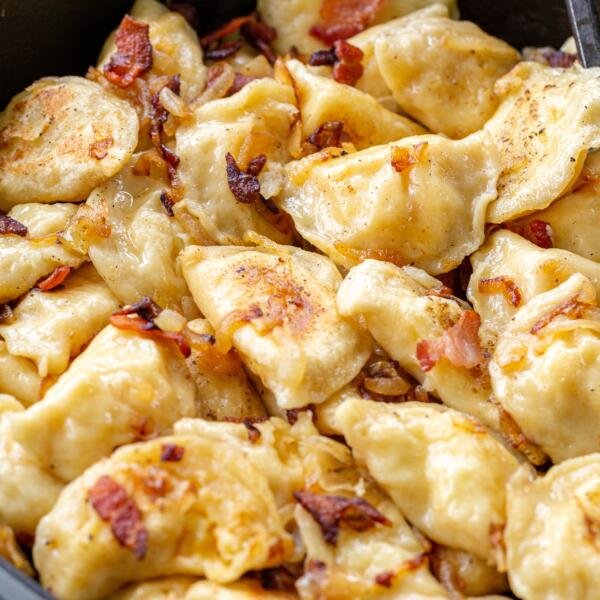 PIerogi with onion in a pan