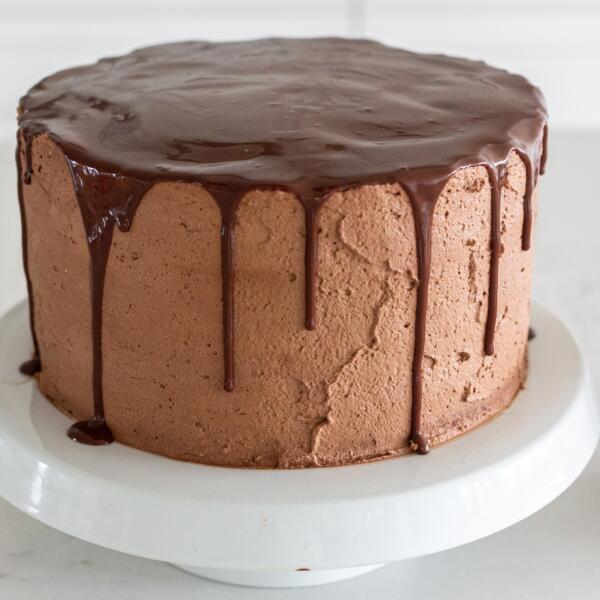 Strawberry chocolate cake on a cake stand