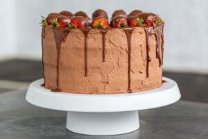 Strawberry chocolate cake on a cake stand