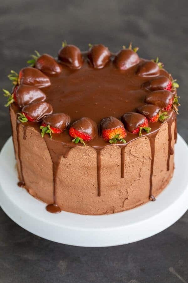 Strawberry chocolate cake on a cake stand